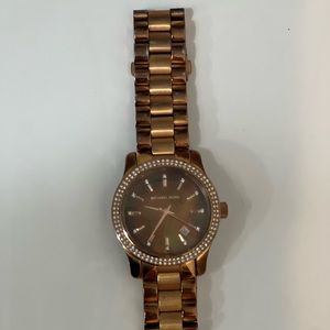 Michael Kors women’s watch. Used but good condition. Needs battery